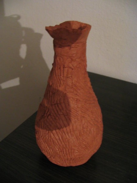 Oranginina steklenička, oblečena v das maslo - vzorček je narejen s školjko